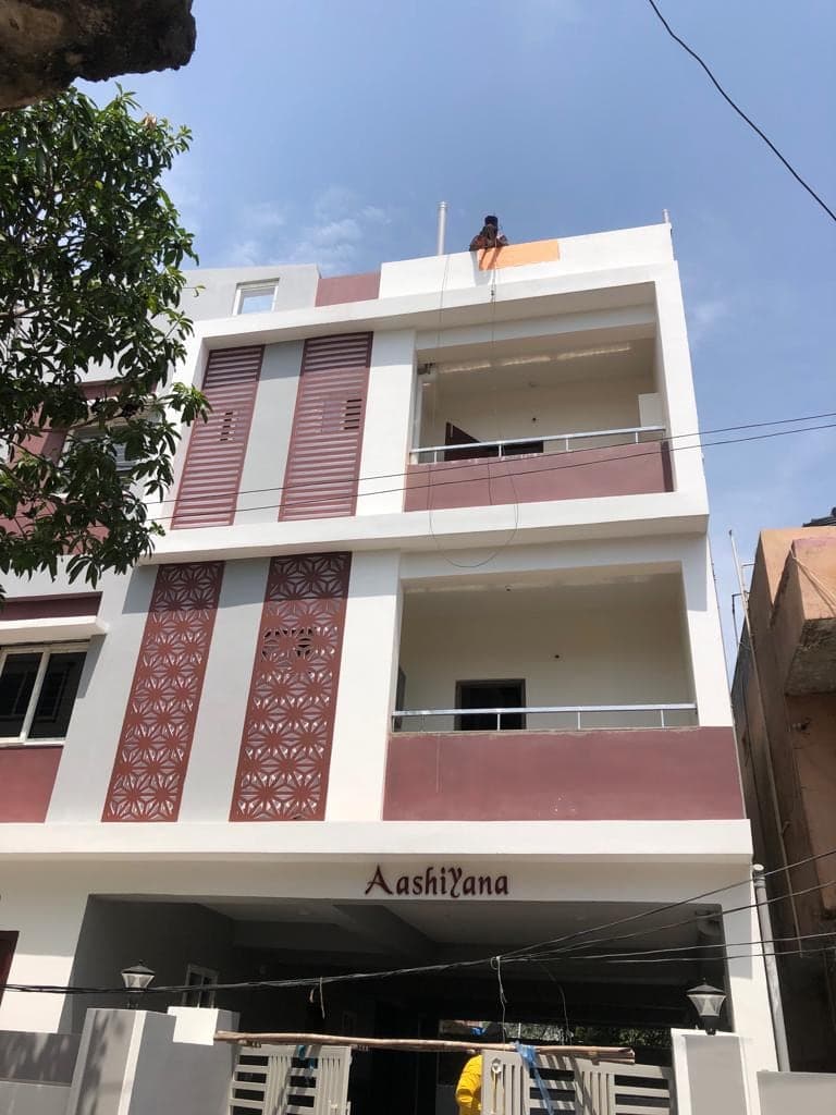 Aashiyana residential building with decorative jali screen panels, in final finishing stage